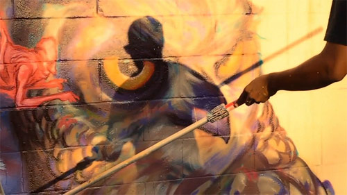 Artist Ekundayo paints Kapahulu Hawaii