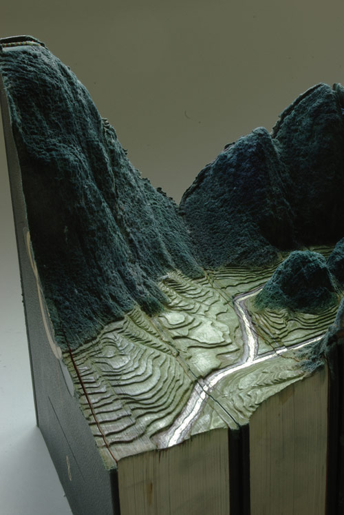 Book sculptures by artist Guy Laramee
