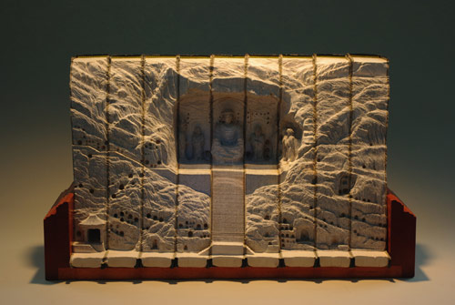 Book sculptures by artist Guy Laramee