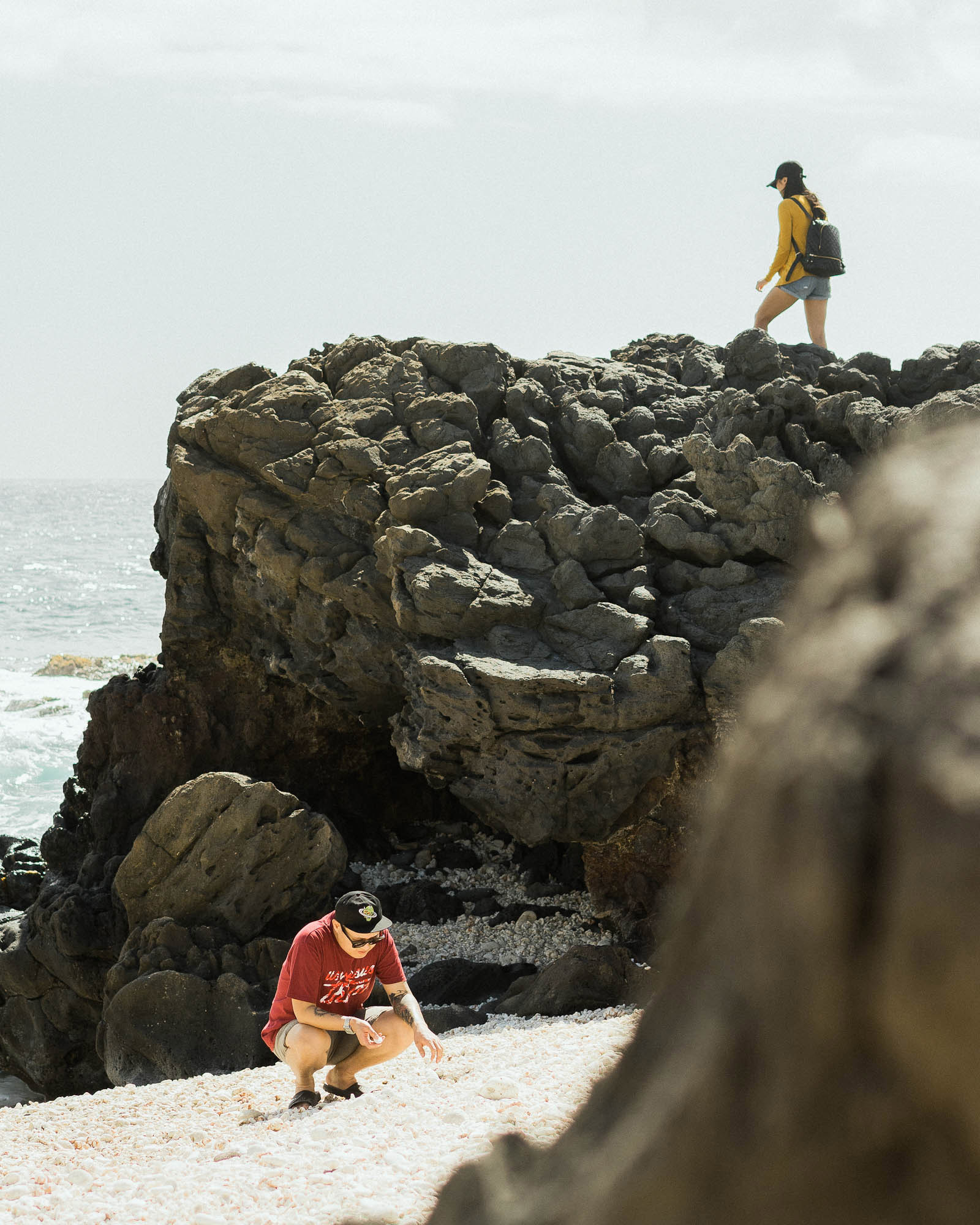 Artists Sixcoin and Tran Nguyen exploring Kaʻena Point, the western most tip of O'ahu.